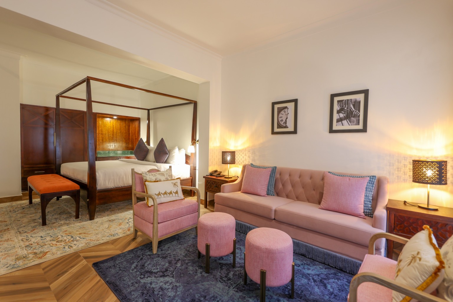 A sofa, armchairs and ottomans in the separate lounge area of an Executive Suite.