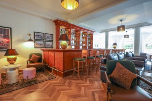 The wood-panelled 1950s Bar, with its herringbone floor, leather seating, framed prints and shelved spirits.