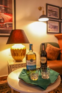 The wood-panelled 1950s Bar, with its herringbone floor, leather seating, framed prints and shelved spirits.