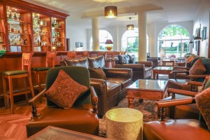 The wood-panelled 1950s Bar, with its herringbone floor, leather seating, framed prints and shelved spirits.