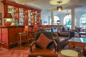 The wood-panelled 1950s Bar, with its herringbone floor, leather seating, framed prints and shelved spirits.