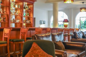 The wood-panelled 1950s Bar, with its herringbone floor, leather seating, framed prints and shelved spirits.