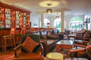 The wood-panelled 1950s Bar, with its herringbone floor, leather seating, framed prints and shelved spirits.