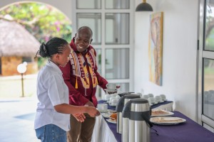 Delegates helping themselves at the tea and coffee station during a break.