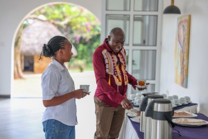 Delegates helping themselves at the tea and coffee station during a break.
