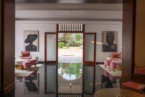 The reception hall and desk, framed by a timber doorway with painted chests either side.
